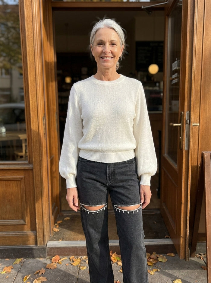 Claire in our Grya Sweater & Ritia Jeans